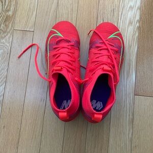 Orange Nike mercurial cleats